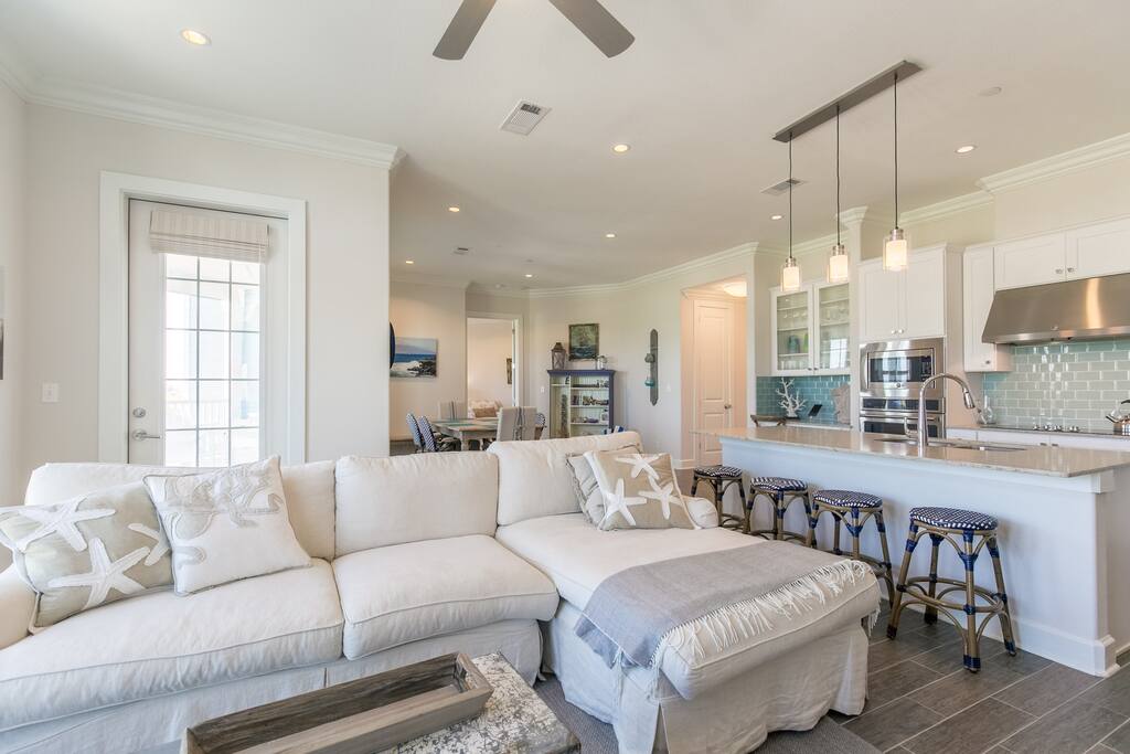 Nautical style and a comfy sectional in the open living area