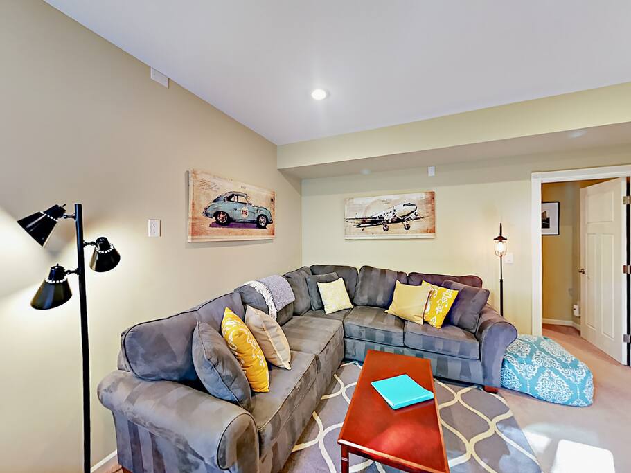 The open living space has tasteful art and decor.