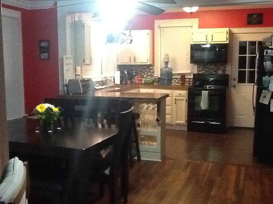 View from living room, into the dining room & kitchen area.