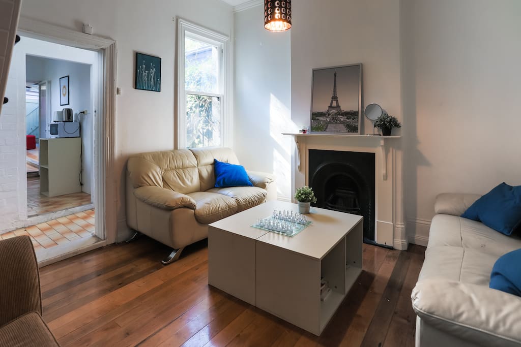 Another view of the spacious living room, with a glimpse of the kitchen.