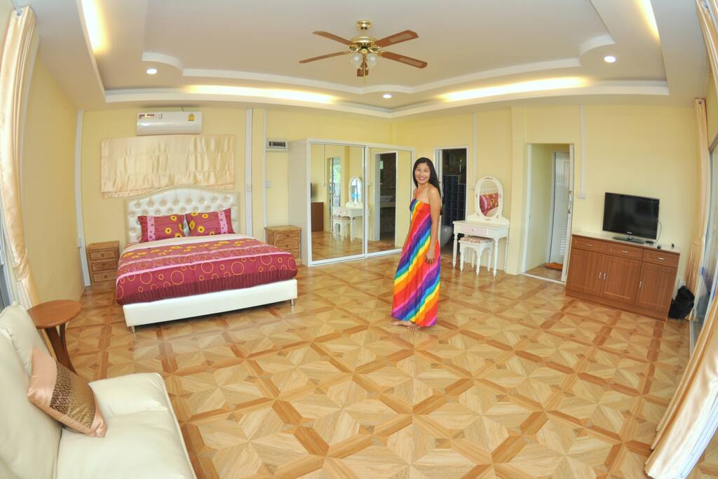 6m x 6m Bedroom / Living Room. Super Comfy Dunlopillo King Sized Bed, Large mirror fronted wardrobe, Dressing Table, Bedside Tables, Sofa, TV for use with your HDMI device, large Air Con Unit and ceiling fan.