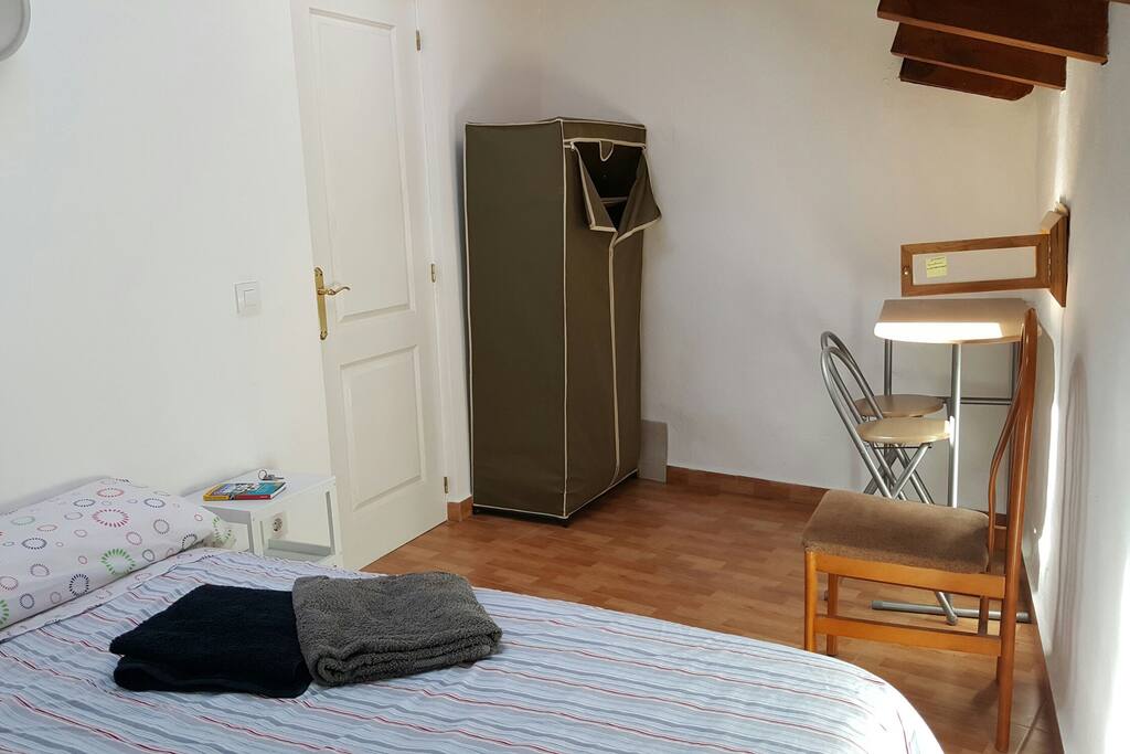 Guest room with 2 skylights.