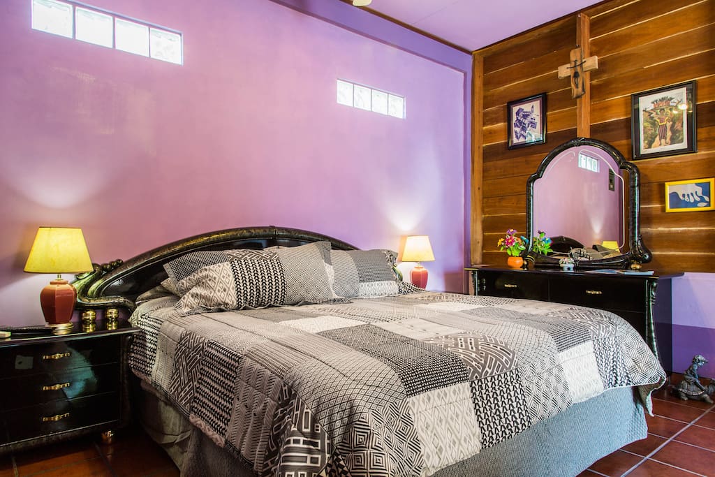 Comfortable king size bed with fluffy feather pillows