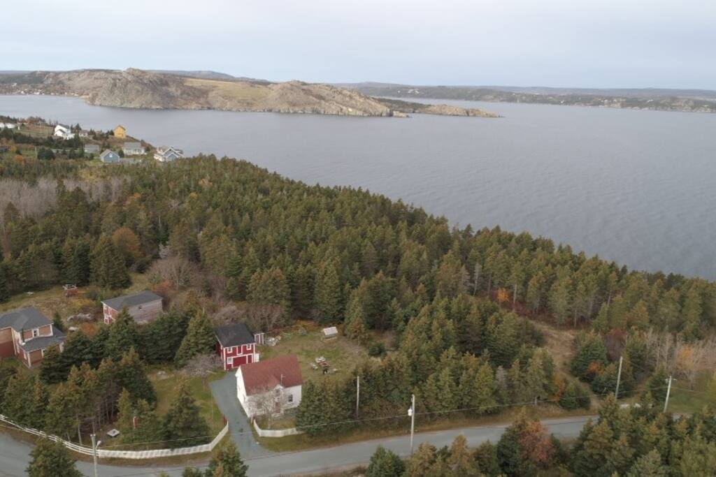 Butler House- white house with red roof. Situated on Cupids harbor.