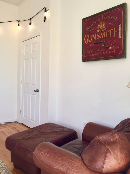 The vintage armchair and ottoman of your dreams! The best soft leather spot to hang out in.