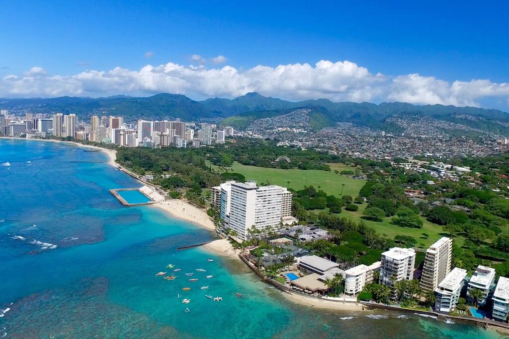 Our building is at the end of Waikiki across from the park. We are the pyramid-shaped building. The main part of Waikiki is in the background.