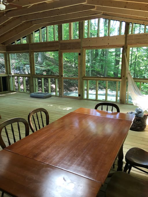 Have breakfast and dinner on the screened-in porch