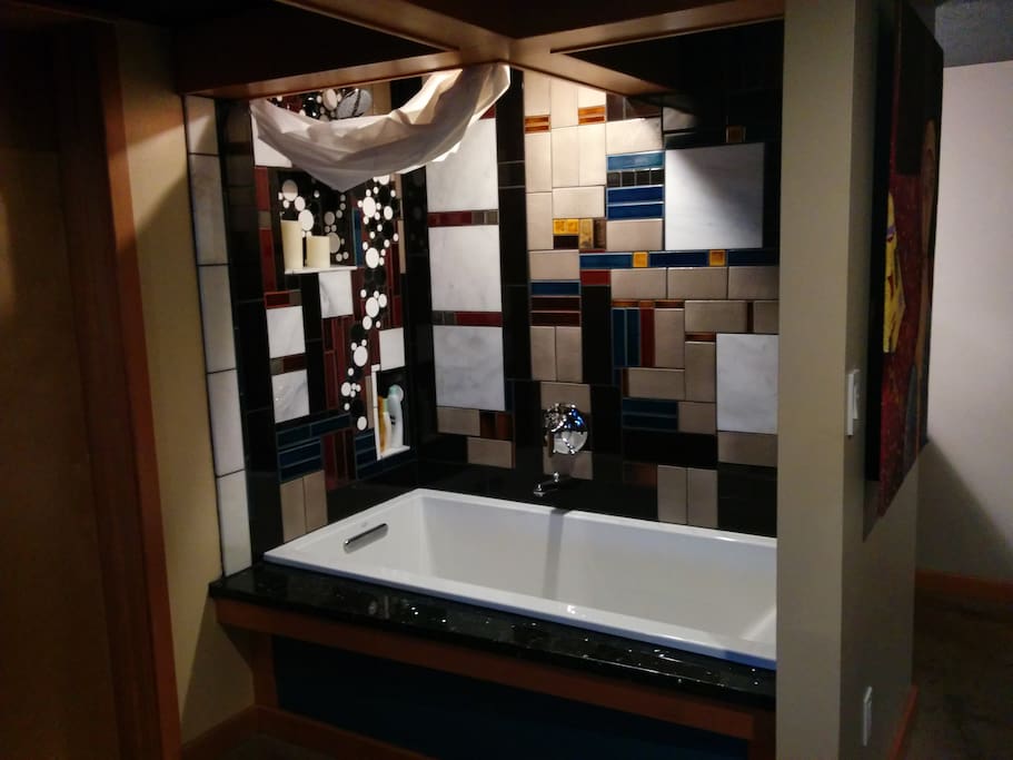 Extra deep bathtub with shower.