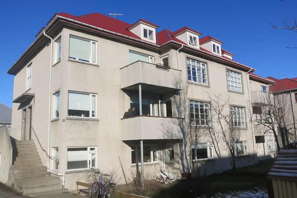 The apartment is at ground level on the left side of the house.A few steps down.