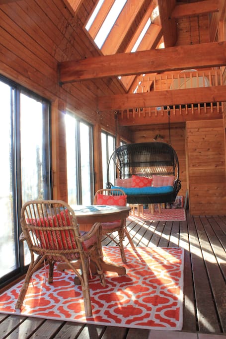 Solarium with breakfast nook and larger swinging chair