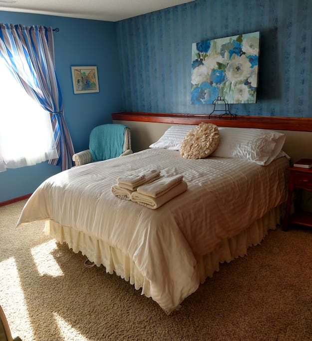 Queen bed. Inner spring mattress. Full closet. Sitting chair. Southern exposure. Chest of drawers.