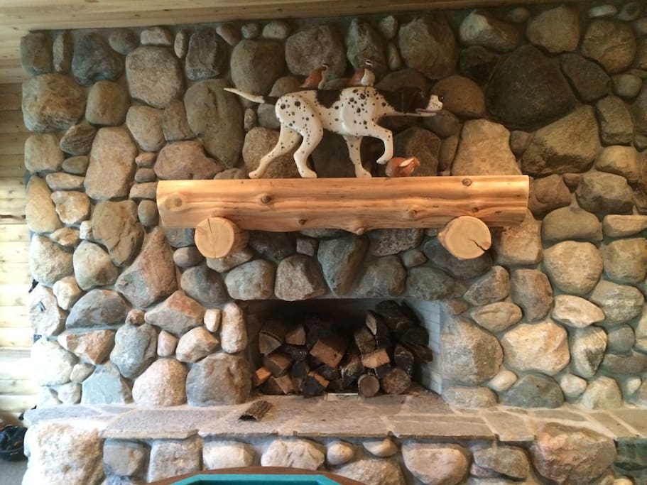Floor to Ceiling Stone Fireplace in Lower Level