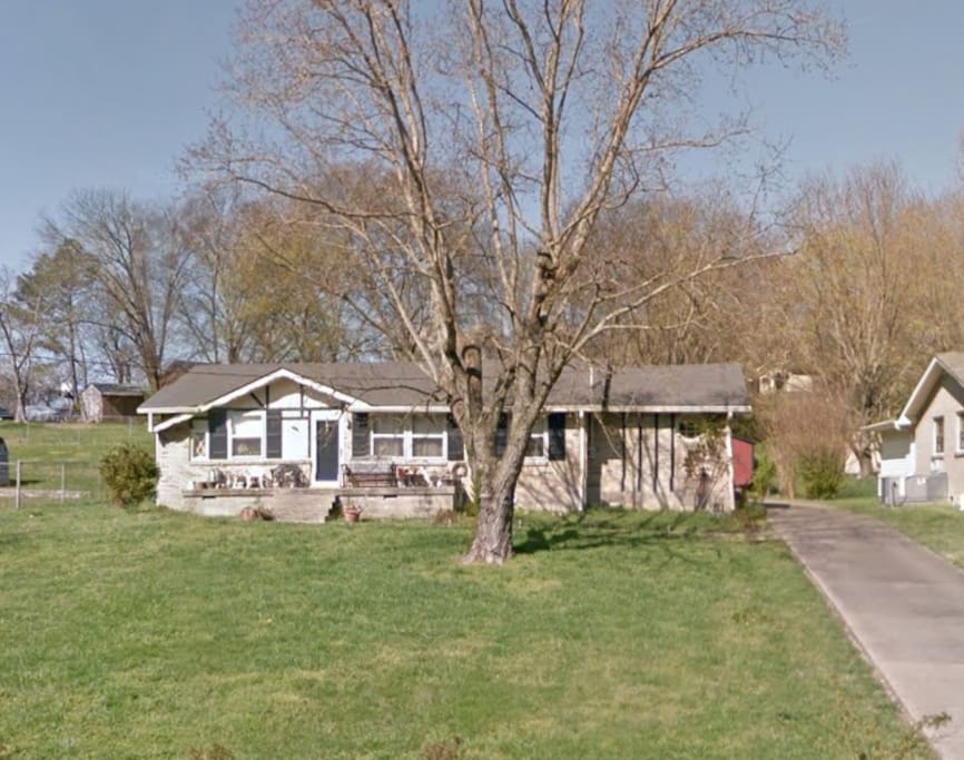 Outside of house. As you can see it has a big yard.