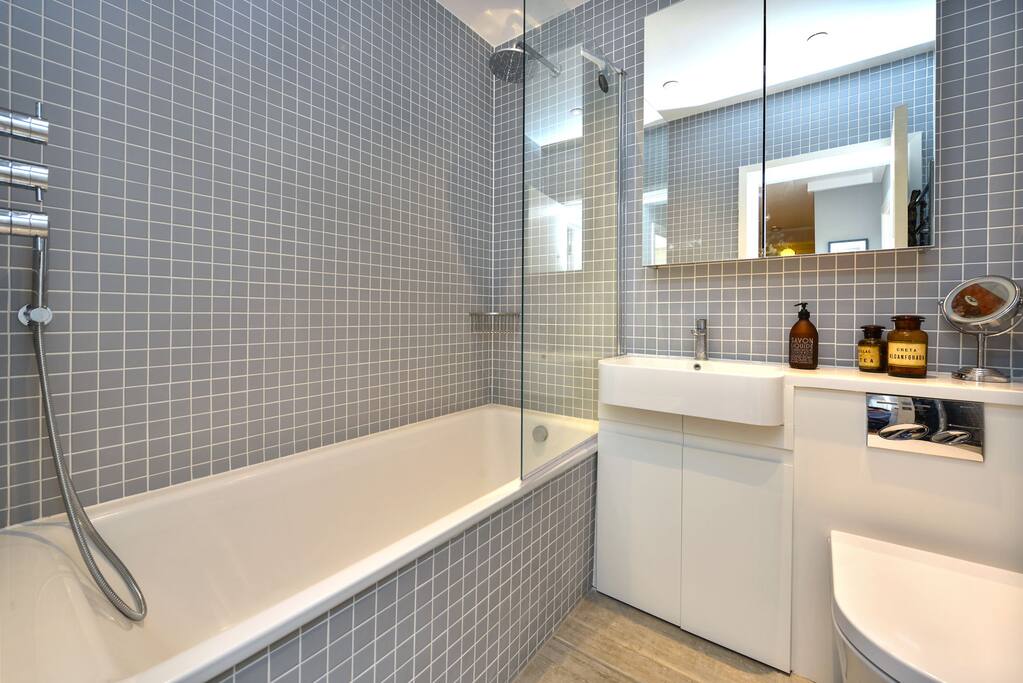 Luxury bathroom with waterfall shower.