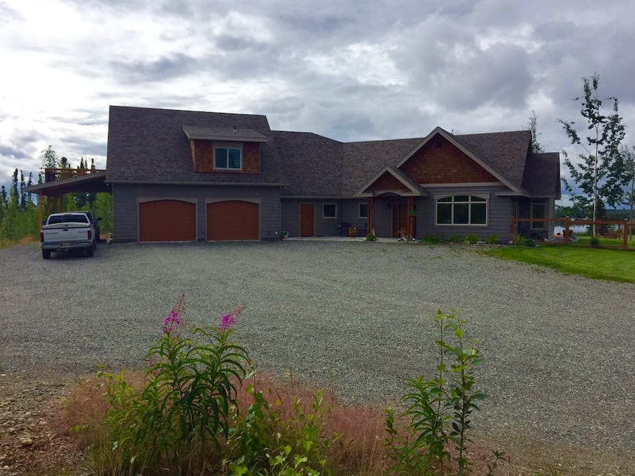 Apartment is above the garage with carport and private coded entrance at rear of garage