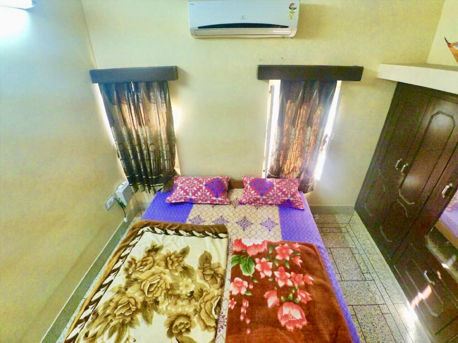 Dale(Room2) A soothing Passion Mango painted room comes with AC newly fitted AC. This room also comes with a Wardrobe and a safe. Its well lit with two garden view