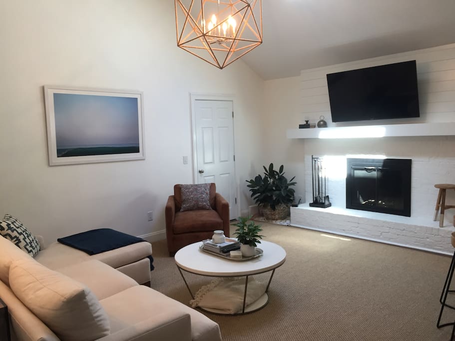 Living room has high ceilings and sky light