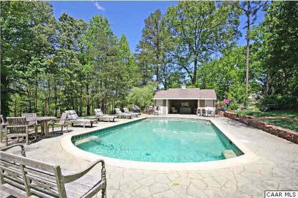 Inground pool with lounge chairs