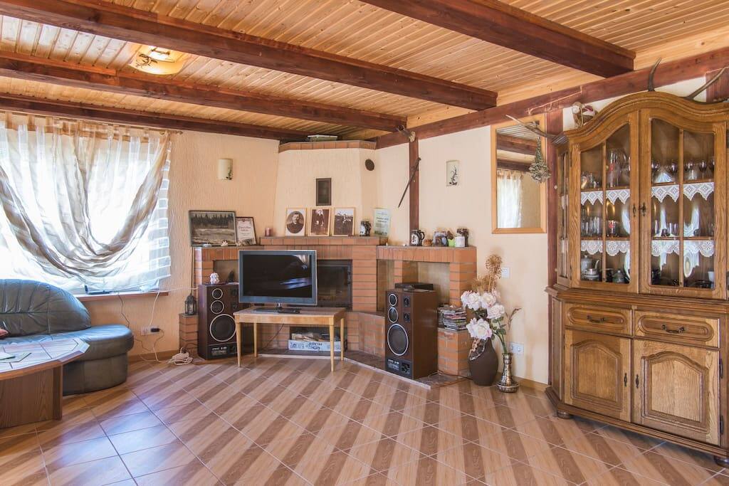 Communal area with a fire-place and a TV