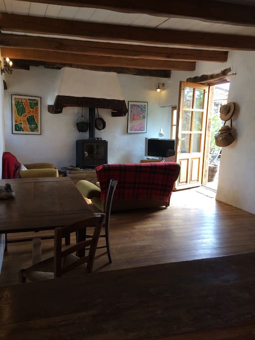 Living room - with TV/DVD and woodburner, showing door to terrace.
