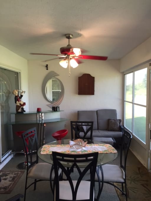 Enclosed porch with bar.
