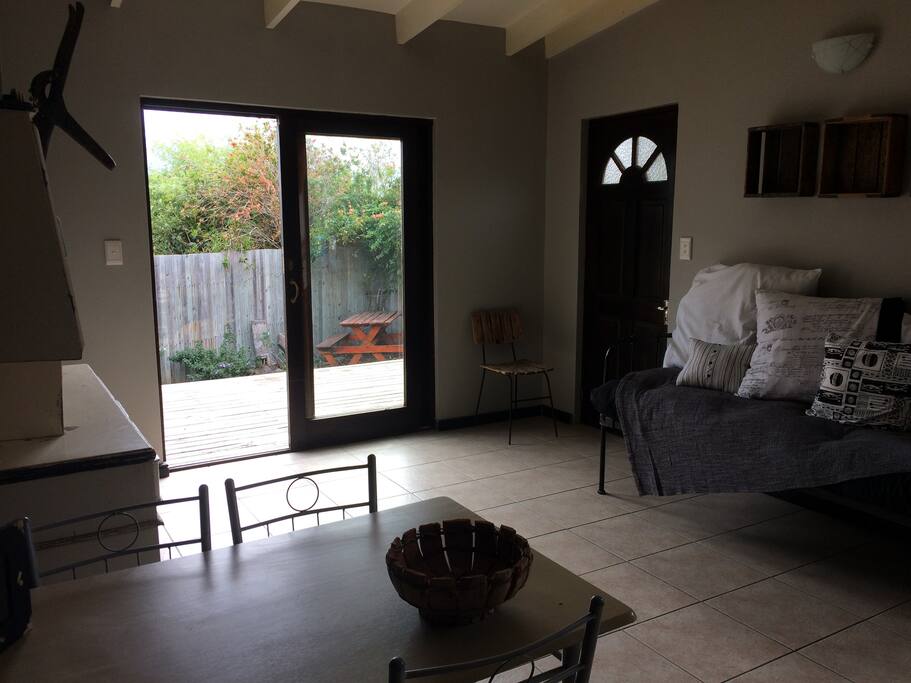 Looking out from kitchenette to the deck, spacious enough to have a family of four to eat and sleep.