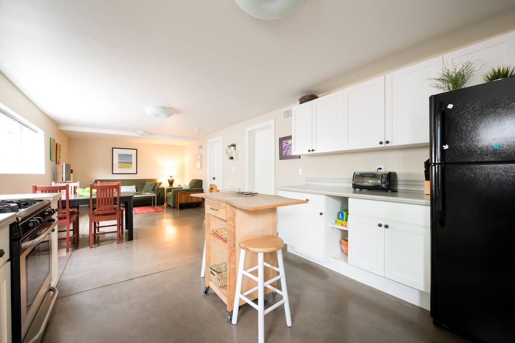 Freshly renovated with a modern and stylish aesthetic. The main room is designed with an open floor plan. It is spacious, functional and bright. Butcher block island in the kitchen with two stools, great for entertaining.