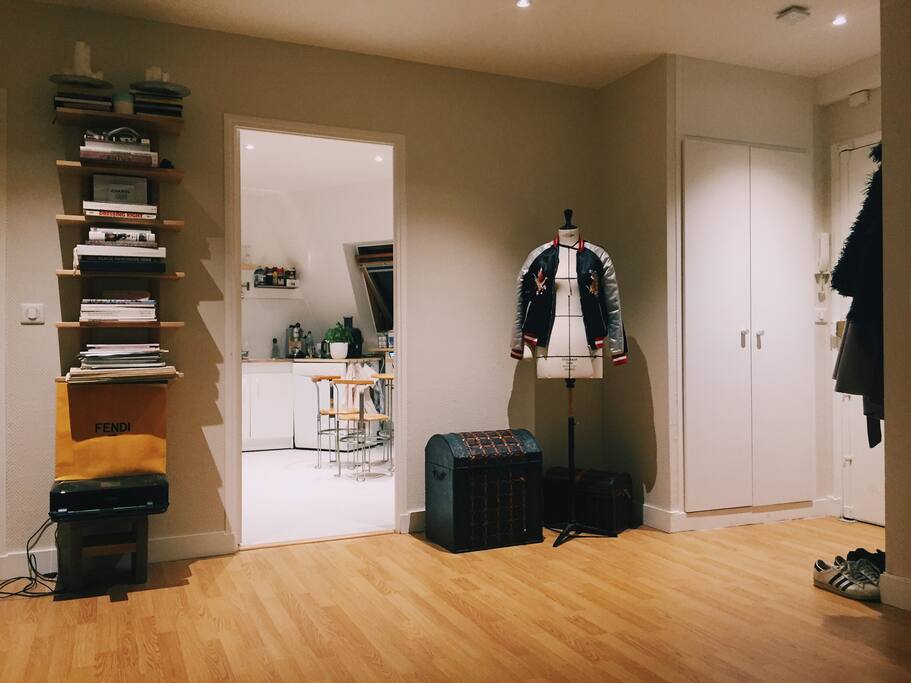 the front door and view into the kitchen from the living room
