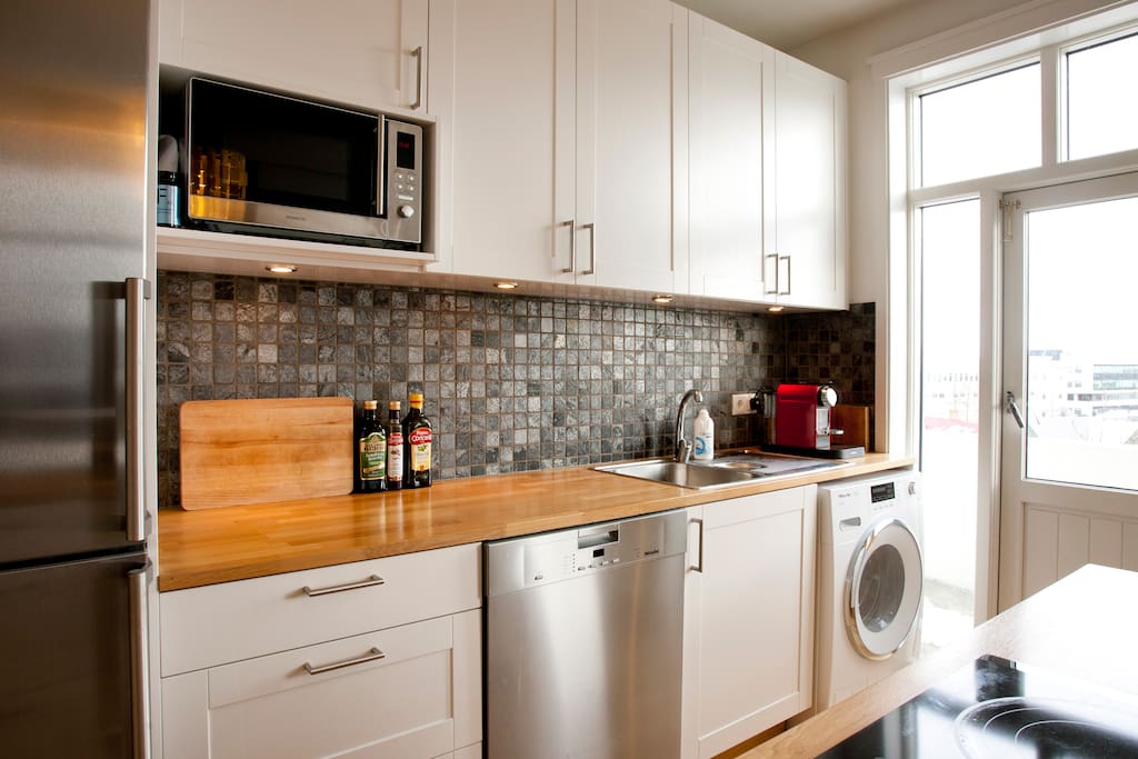 Microwave, nespresso machine, dishwasher and a washing machine.