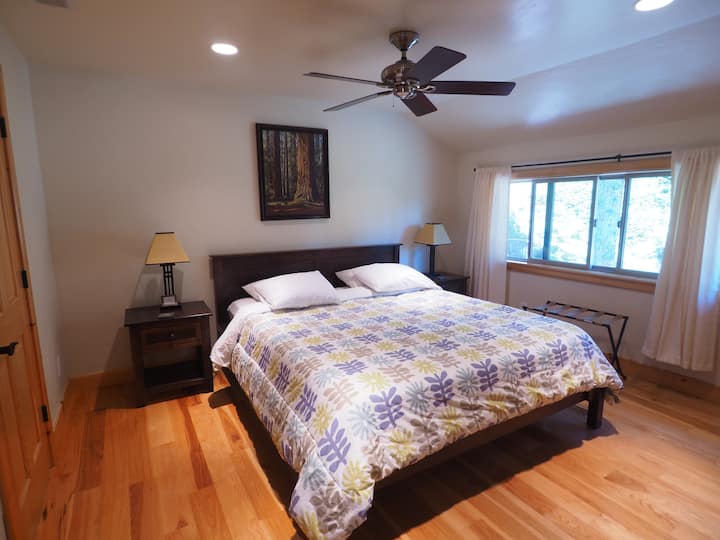 The master bedroom with a California king bed