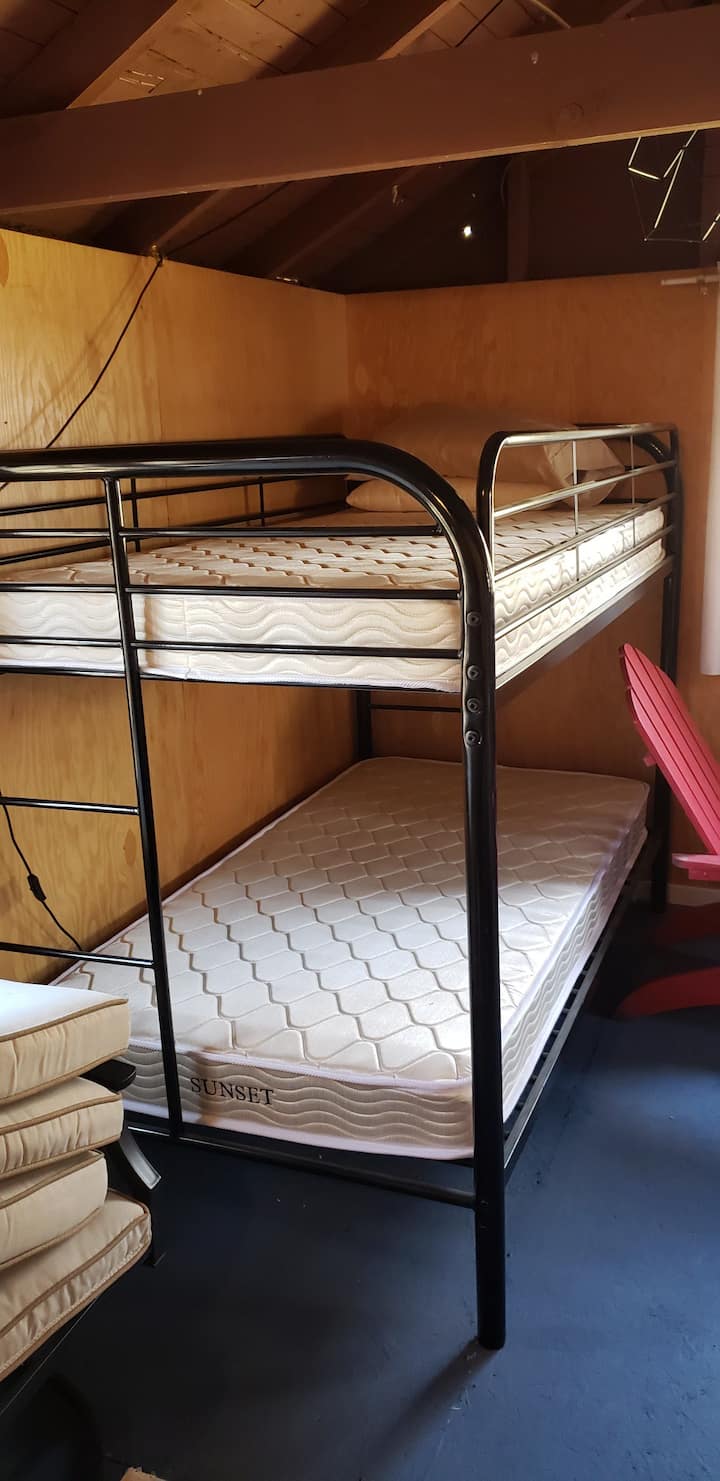 1 of 2 sets of bunk beds in first bedroom of bunk house