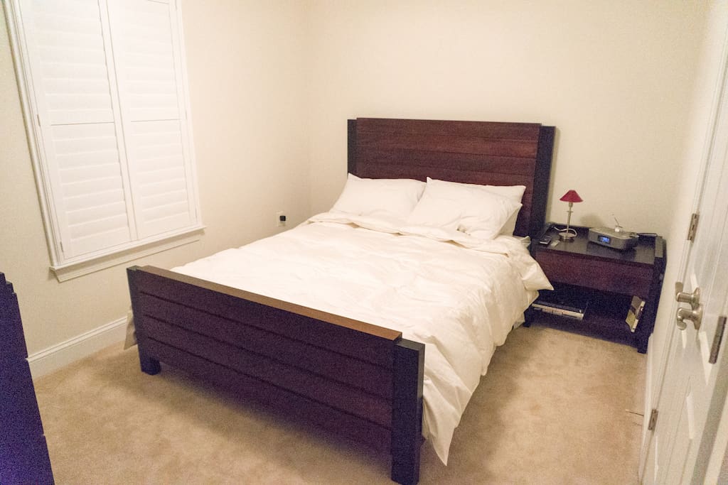 Queen Bed, down comforter, plush and firm pillows. Alarm clock with usb ports and plugs.