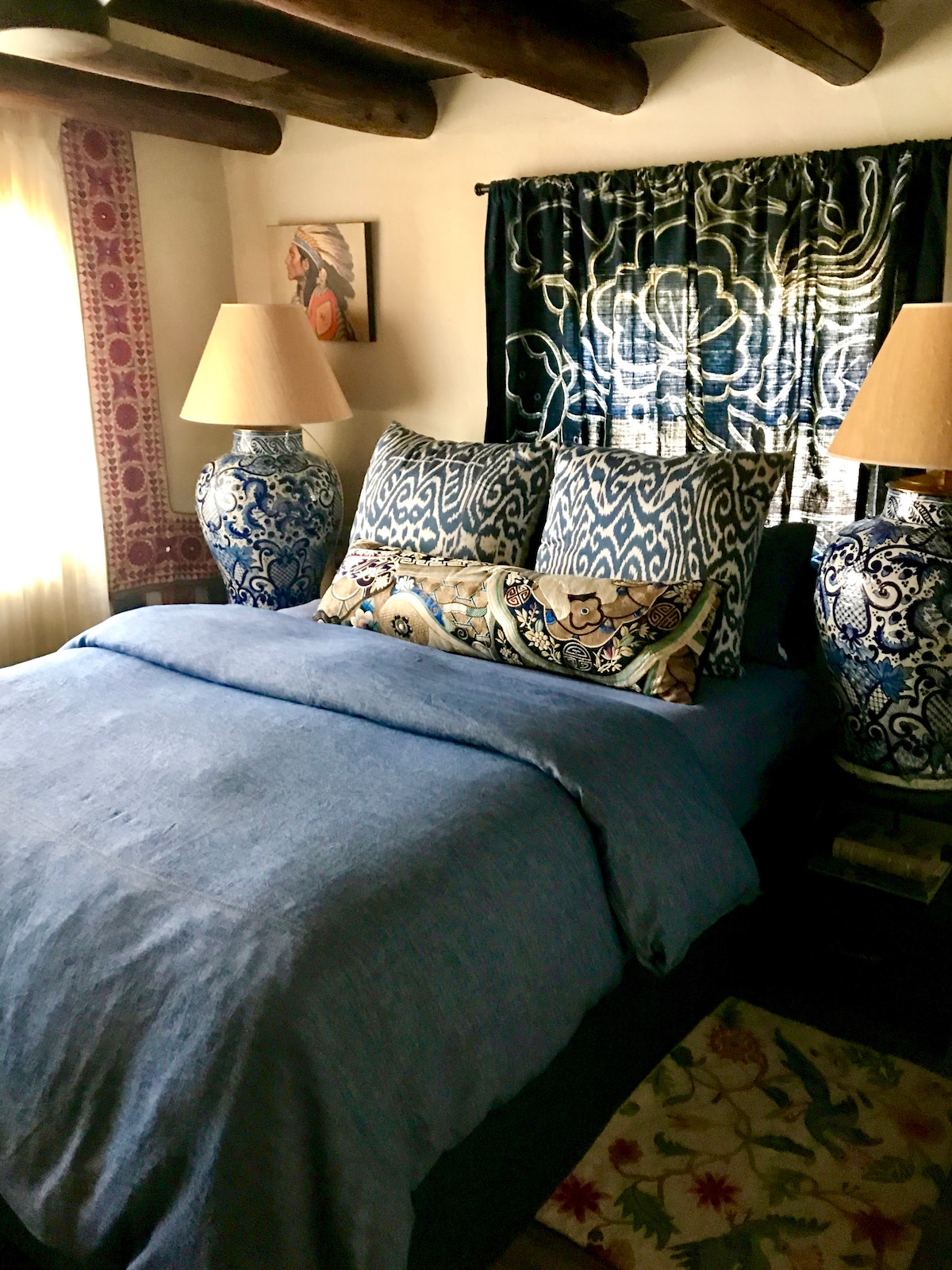 Master Bedroom with ensuite sitting room;  Organic linen sheets, queen hotel mattress.

Amazing interior architecture w/ ceiling vigas, thick adobe walls;  Bedroom has armoire. 