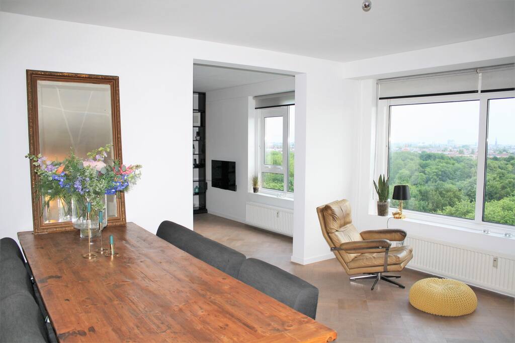 Big dining table with comfy chairs
