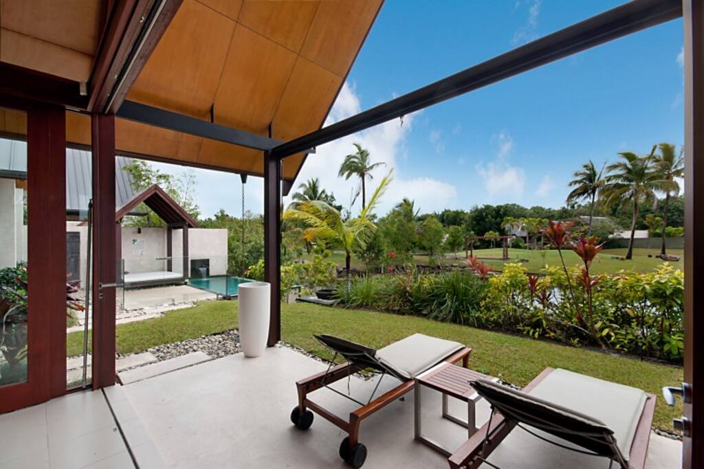 Relax on the sunlounges looking over the lilly pond