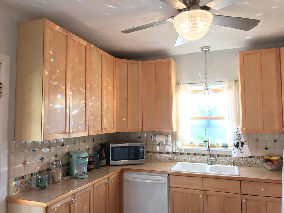 Full kitchen stocked with appliances, microwave, k-cup coffee maker, toaster oven, dish ware, flat ware etc.