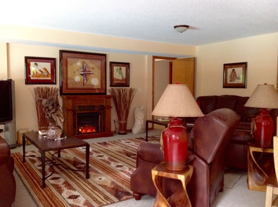 The living room fireplace wraps you in warmth, and dispels any lingering chill.