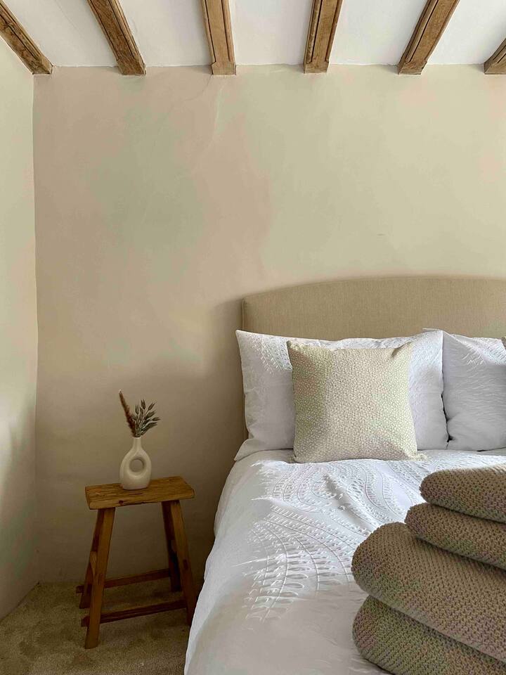 Bedroom one features a Cotswold company double bed, this bedroom also has a walk in dressing area.