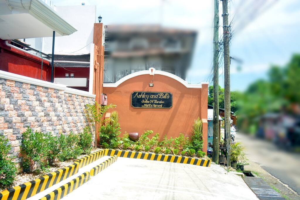 Ashley and Bill's Suites 'N Garden Signage