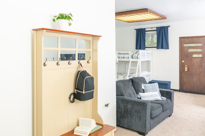 The kids bunkroom has 3 bunkbeds, a couch, a TV, electric fireplace and toys to keep the kids entertained!