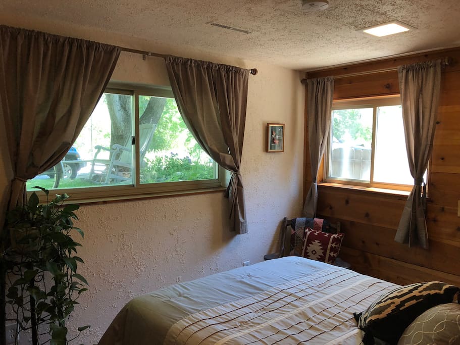 Master bed looks out over open space in the tranquil Green Belt of Tucker Gulch.