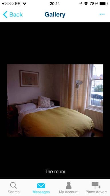 Bedroom, has a large closet, mantel piece, large windows and now a small desk.