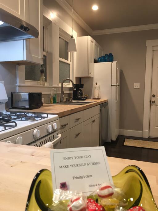 Full kitchen, lots of natural light. Simple- clean style. Fully remodeled. Gas stove, exhaust, full size dishwasher, garbage disposal and microwave. Coffee maker and toaster. Cookware, dinnerware, silverware, all you need to feel at home.