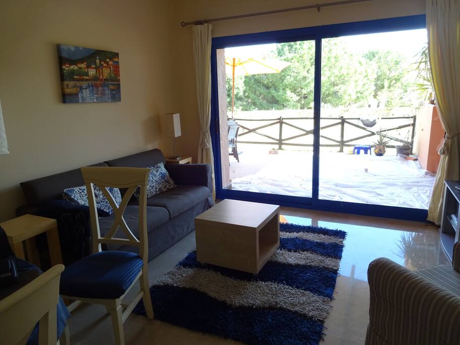 View on our living room, spacious terrace and garden.
