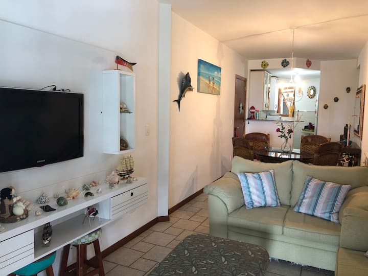 Living and dining room. American cuisine in the background.