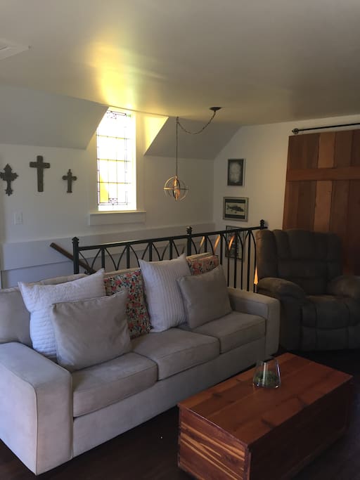 Upstairs den with original stain glass windows.