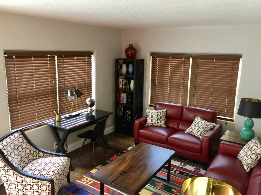 Living room with flat screen tv and workstation
