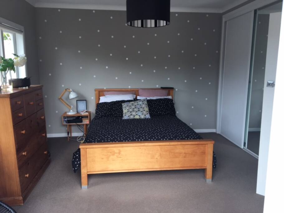 master bedroom with French doors opening to deck