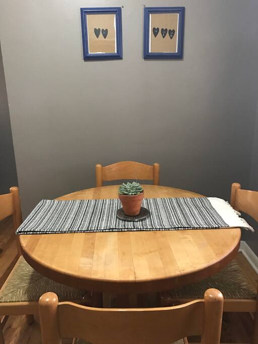 Cozy table off the kitchen for shared meals! Enjoy the hand printed artwork by one of Rae's Chicago friends.