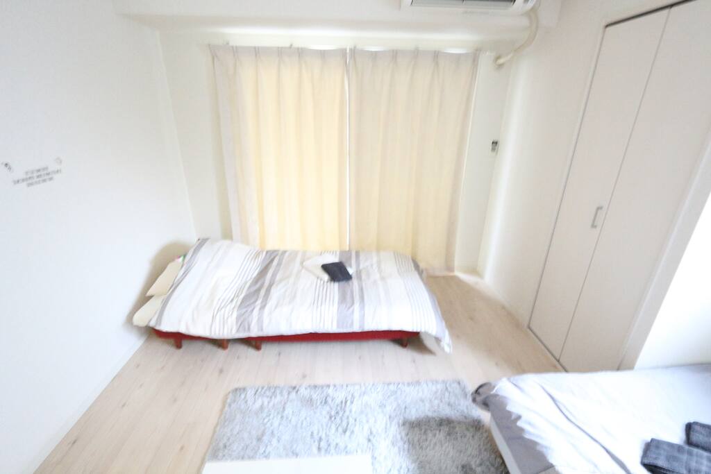 Single sofa bed set up for sleeping